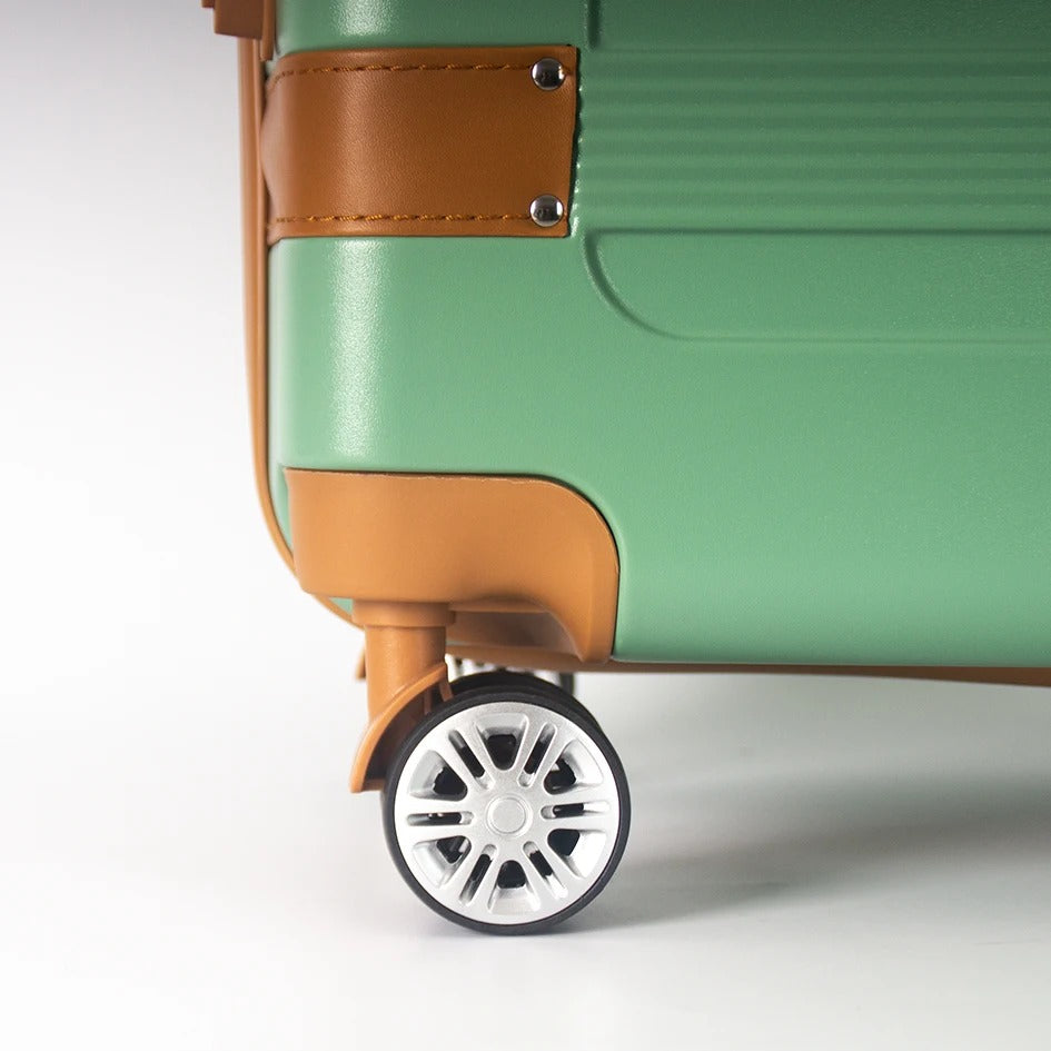 Green 28 inch hard-shell suitcase with brown accents