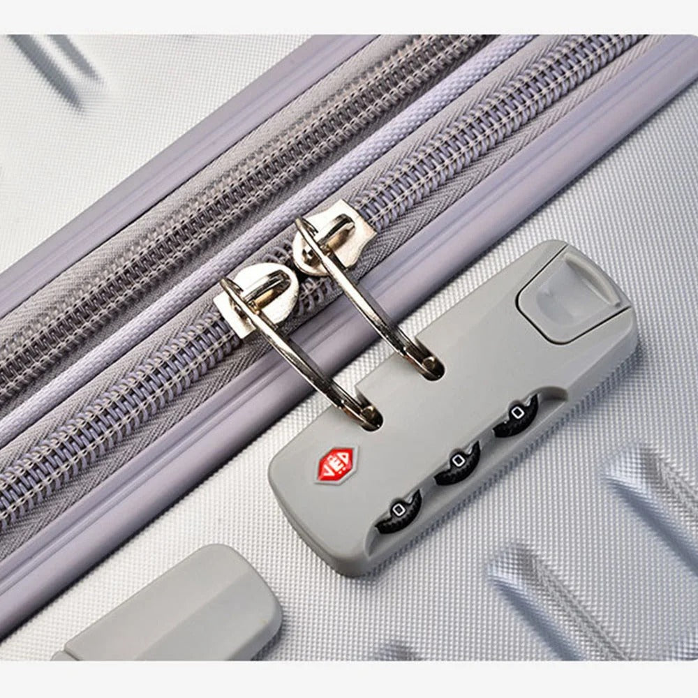 Silver hard-shell suitcase with diagonal lines and spinner wheels