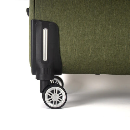 Green soft-shell suitcase with fabric exterior and spinner wheels