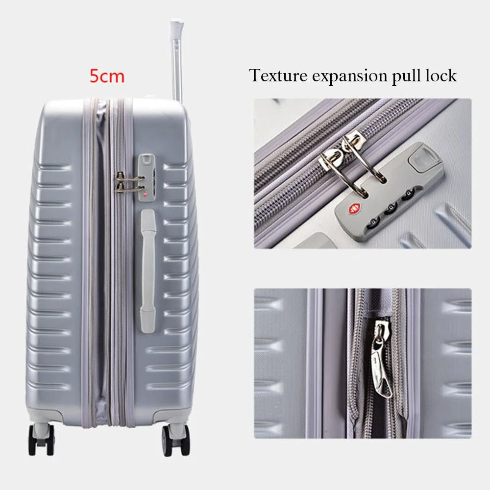 Silver hard-shell suitcase with diagonal lines and spinner wheels
